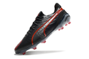 Chuteirta Campo Puma King Ultimate FG Preta e Vermelha "Launch Edition Pack"