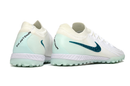 Chuteira Society Nike Phantom GX 2 Elite TF Branca e Verde "Chromatic"
