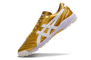Chuteira Society Asics Japan TF Dourada e Branco