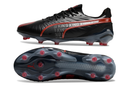 Chuteirta Campo Puma King Ultimate FG Preta e Vermelha "Launch Edition Pack"