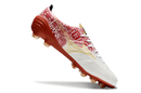 Chuteira Campo Mizuno Alpha FG Branca, Vermelho e Dourado "Signature Pack"